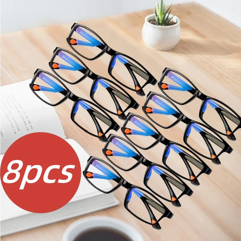 A set of eight black-framed multifocal reading glasses with blue and orange lenses displayed on a wooden surface.