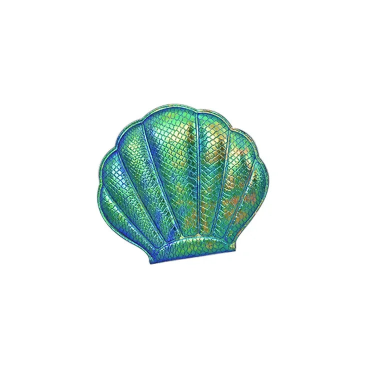 A teal and green textured seashell-shaped makeup mirror.