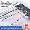 Stainless steel U-shaped tongue scraper shown on a gray surface, demonstrating how to scrape off tongue coating for oral hygi