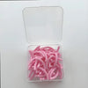 A clear plastic container holds 30 pink reusable silicone eyelash curler pads.