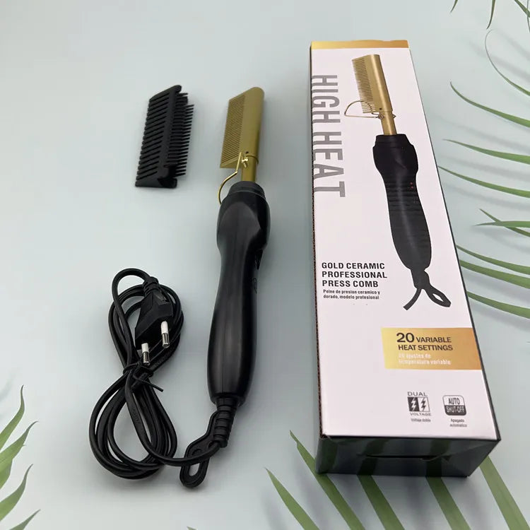 A box and a gold ceramic professional press comb with a cord are displayed on a light surface.