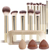 A set of thirteen professional makeup brushes and paddle applicators with a beige storage bag.