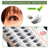 Close-up of natural wispy eyelash extensions being applied to an eye, showing the lash clusters.