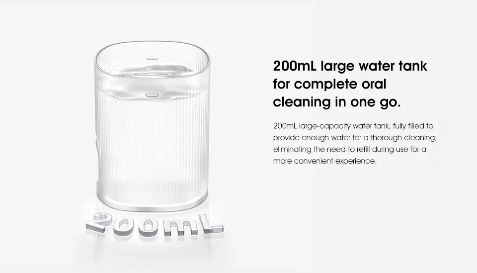 A clear glass water tank used for an electric oral irrigator.