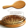 A wooden comb with bamboo bristles used for scalp and hair growth.