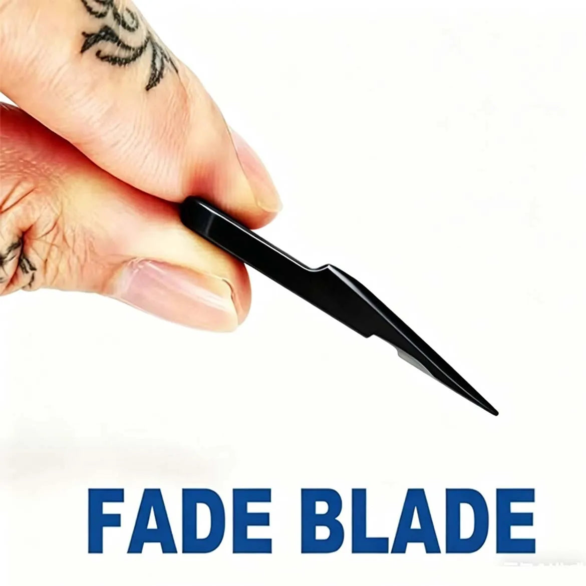 A hand holds a black fade blade precision hair clipper trimming tool.