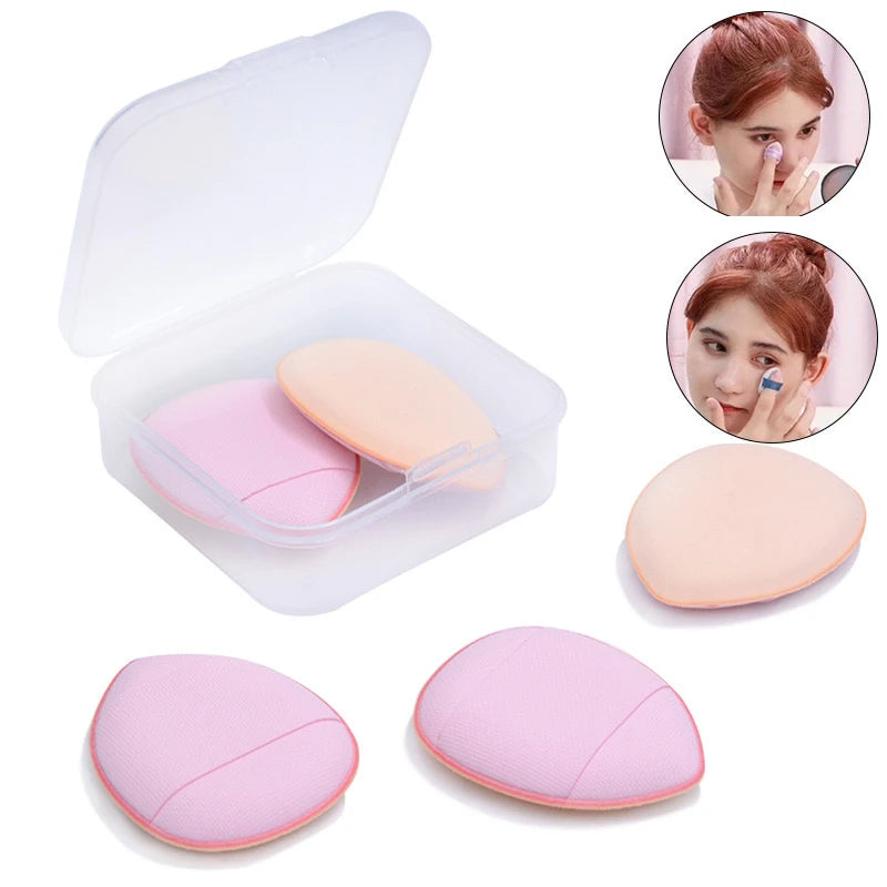 A set of pink mini finger puff foundation applicator tools, including an open case and several individual applicators.
