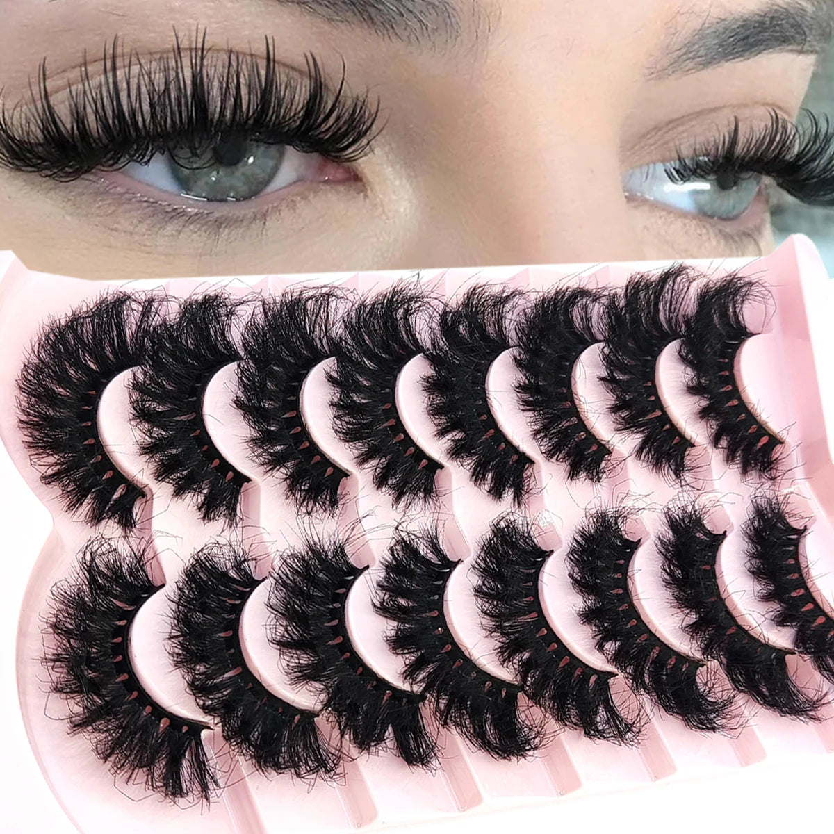 A close-up of a pink tray holding natural mink striped false eyelash extensions.