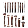 A collection of professional makeup brushes in various sizes and shapes for foundation and eyeshadow application.