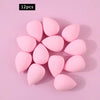 A set of 12 pink, oval-shaped XL soft makeup sponges arranged on a light pink background.