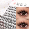 Close-up of natural black eyelash extensions applied to an eye, showing the lash density and curl.