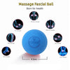 Una pelota facial azul para masaje con puntos de masaje indicados en el cuerpo.