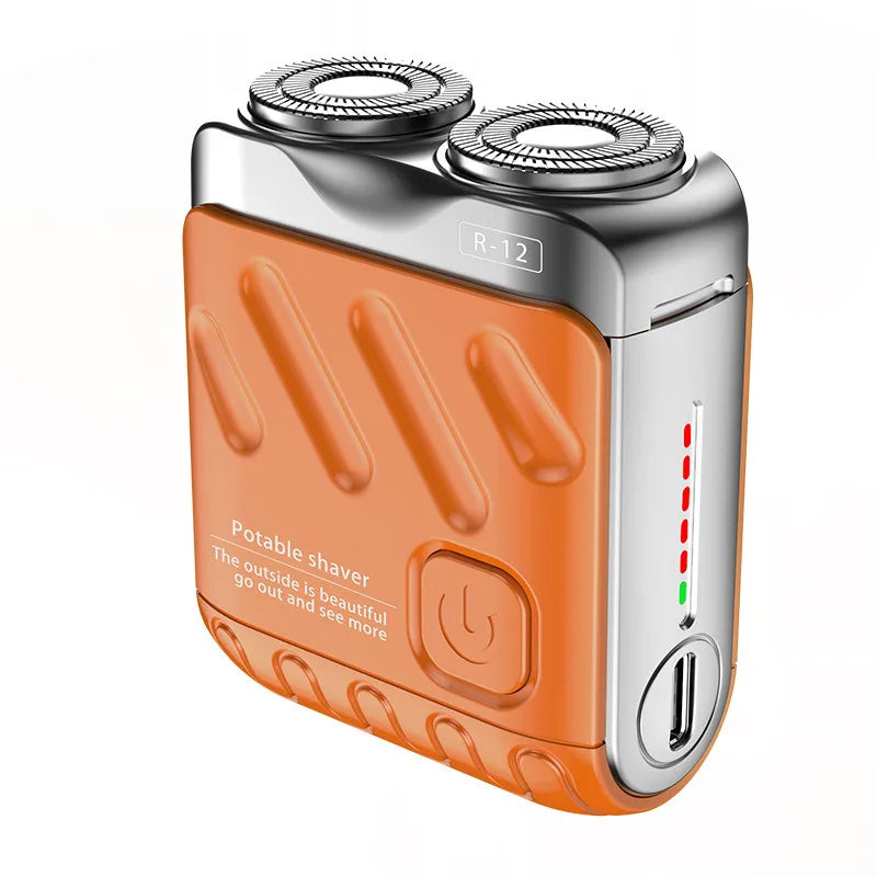 An orange and silver magnetic electric shaver with a removable head is shown.