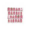 A set of 24 nude pink press-on nails featuring a leopard print and 3D charms.