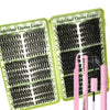A set of individual lashes in various lengths and styles packaged in a green plastic case.