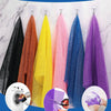 A display of exfoliating mesh body scrubbing towels in various colors including black, orange, yellow, pink, blue, and purple