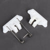 A white hair clipper swing head replacement parts kit showing a plastic housing and a metal spring.
