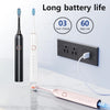 A professional sonic electric toothbrush in black and white is shown next to a charging adapter, demonstrating long battery l