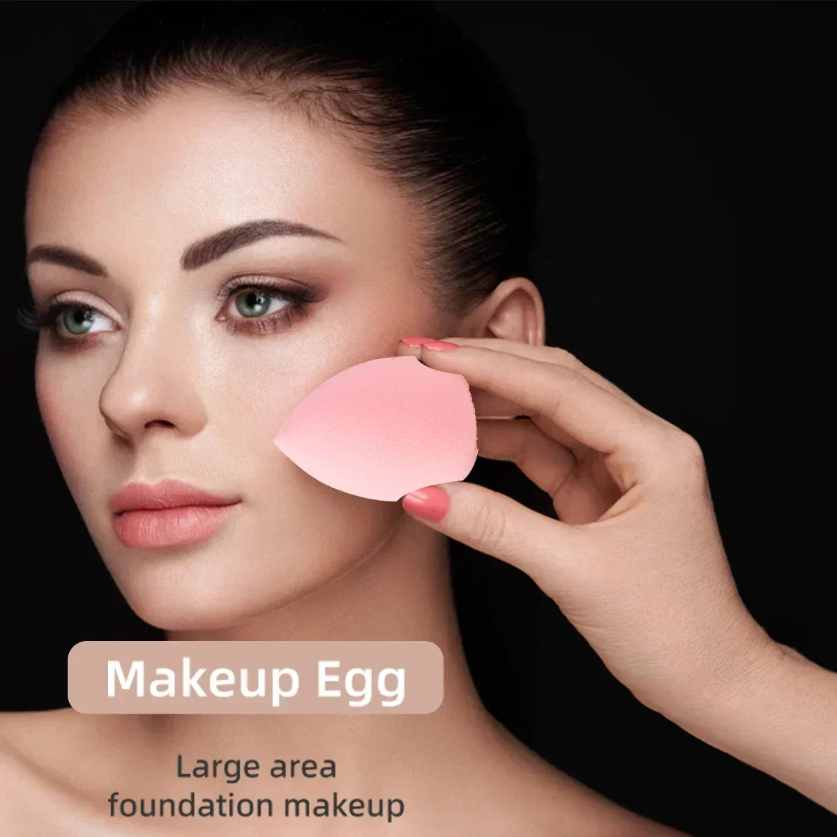 A hand applies a pink makeup egg foundation to a woman's face for large area coverage.