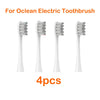 Four white replacement brush heads for an Ocean electric toothbrush are displayed.