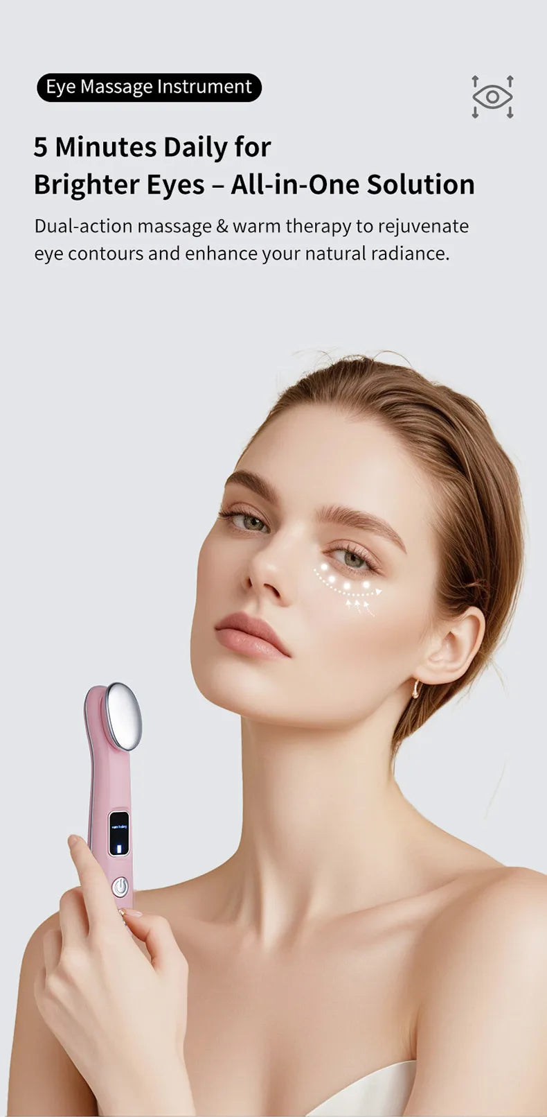 A woman is using a pink eye massage instrument on her face to rejuvenate her eyes.