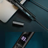 A black electric portable hair and nose trimmer is shown next to a laptop keyboard and a close-up view of its display.