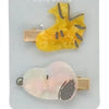 A set of two yellow and pink Snoopy cartoon hair clips