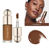 A cosmetic product featuring a liquid bronzer contour foundation stick in a gold tube and a brown swatch.