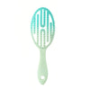 Peigne de coiffage vert menthe clair avec dents bleu sarcelle pour soins des cheveux mouillés et secs.