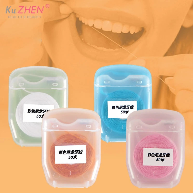 Three containers of 50m disposable nylon dental floss in green, blue, and pink.