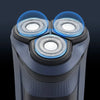 Close-up view of an intelligent rechargeable electric shaver with three rotating shaving heads.