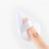 A hand is holding a white reusable velvet powder puff set with a white strap.