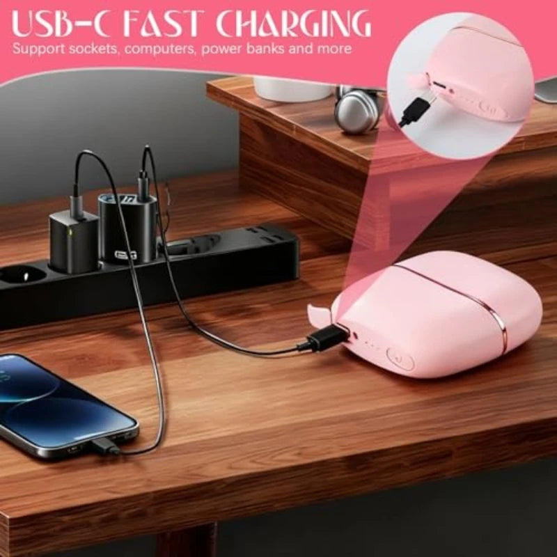 A pink portable mini hair straightener with temperature control is shown plugged into a USB-C fast charging setup on a wooden