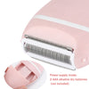 A pink electric body shaver and trimmer device with a removable head and battery compartment.