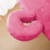 A bright pink reusable U-shape pillow cover used for massage or beauty treatments.