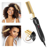 A black 2-in-1 straightening comb with a gold-colored handle and plates is shown alongside a woman using the tool.