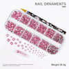 Kit de uñas con adornos de diamantes brillantes rosa y iridiscentes, y cristales sueltos.