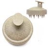 A beige silicone scalp massage and body brush with a flat head and multiple prongs.