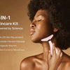 A woman is using a pink LED photon therapy neck and face massager for skin rejuvenation.
