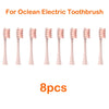 Eight replacement brush heads for an Ocean electric toothbrush, shown lined up.