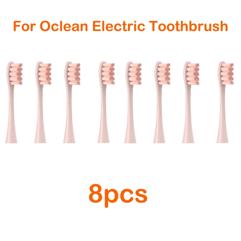 Eight replacement brush heads for an Ocean electric toothbrush, shown lined up.