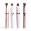 A set of four electric eyebrow trimmers or epilators in rose gold and white packaging.