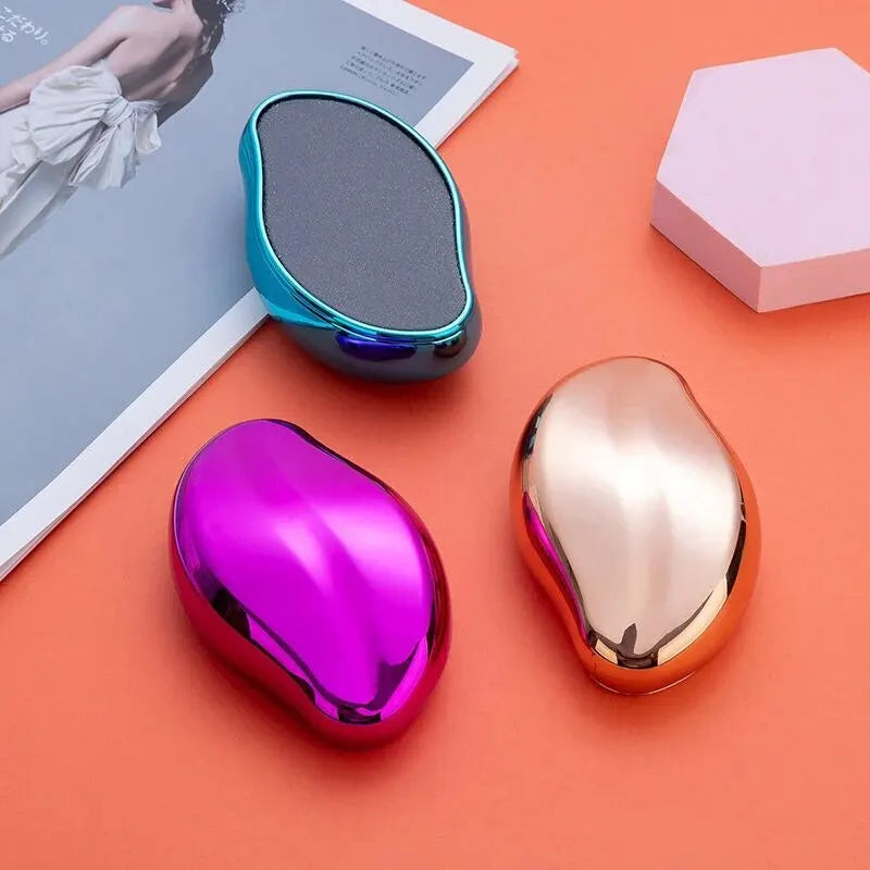 A pink and gold glass foot file tool is shown next to a metallic blue storage case on an orange background.