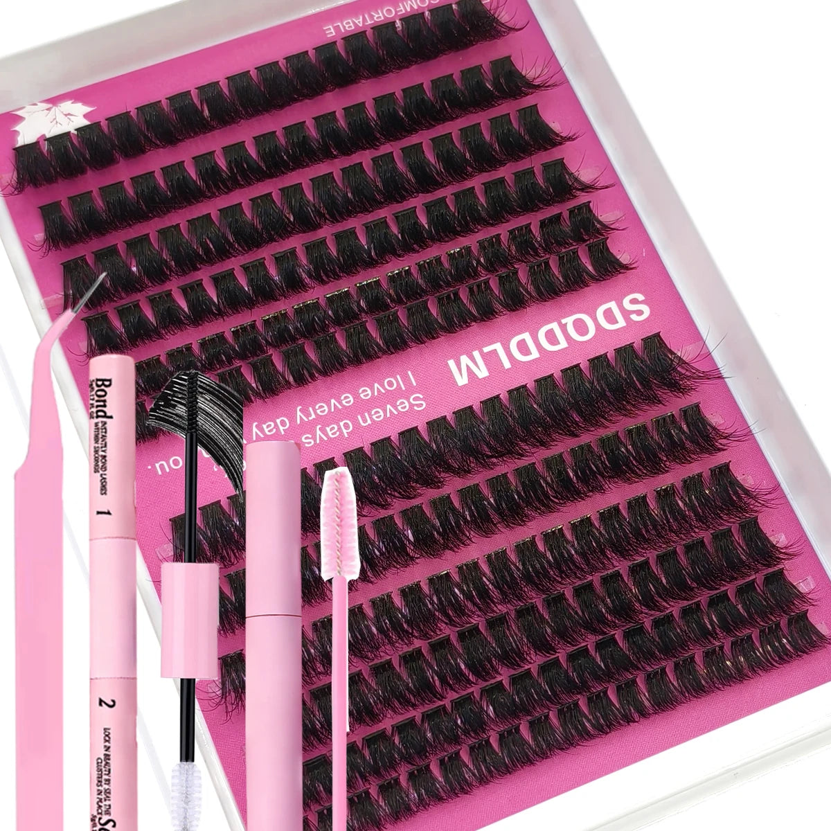 A pink DIY lash extension kit with several pairs of black false lashes displayed in a plastic case.