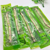 Pack of traditional miswak toothbrushes in green packaging for natural dental care