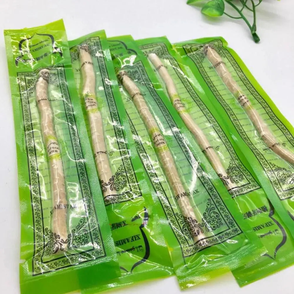 Pack of traditional miswak toothbrushes in green packaging for natural dental care