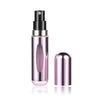 A glass bottle of portable mini perfume refill spray with a black pump and pink liquid, shown against a white background.