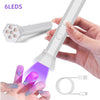 A hand holds a white cordless rechargeable mini UV LED nail lamp and its accompanying cord.