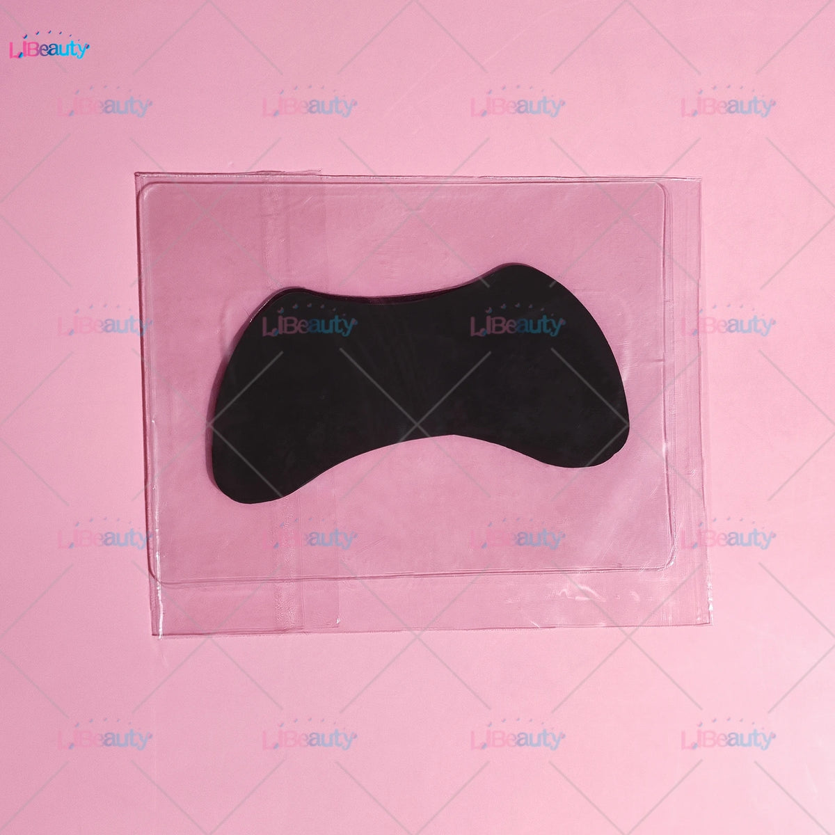 A black silicone lash lift shield eye pad is visible inside a clear plastic packaging.
