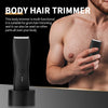 A black professional ceramic body hair trimmer is shown being held by a hand against a man's chest.
